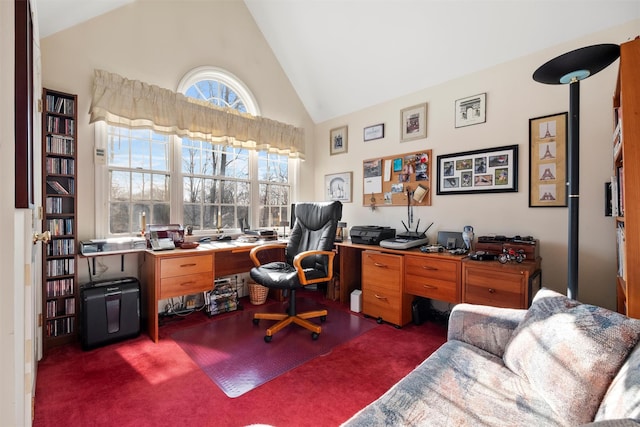 office area featuring high vaulted ceiling and dark colored carpet