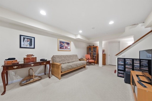 living area with light carpet