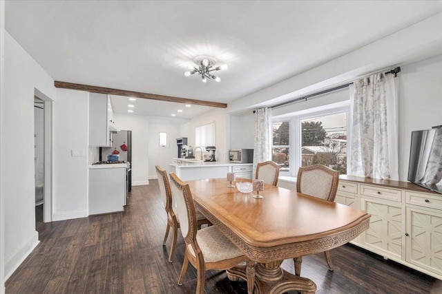 dining space featuring beamed ceiling, dark wood-type flooring, and a notable chandelier