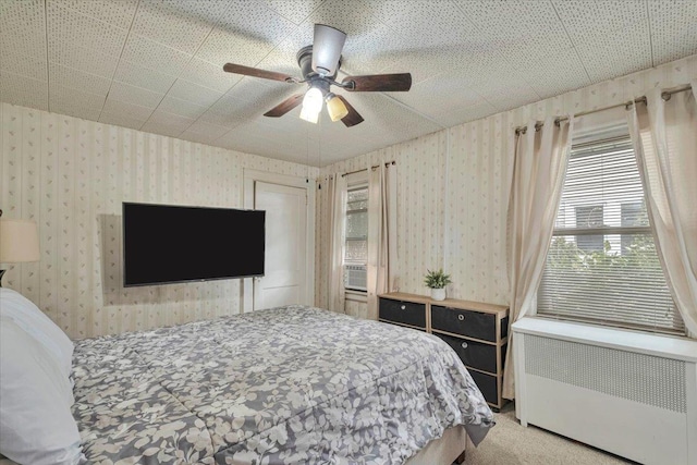 bedroom featuring ceiling fan, carpet flooring, and radiator