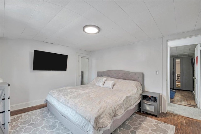 bedroom with hardwood / wood-style floors