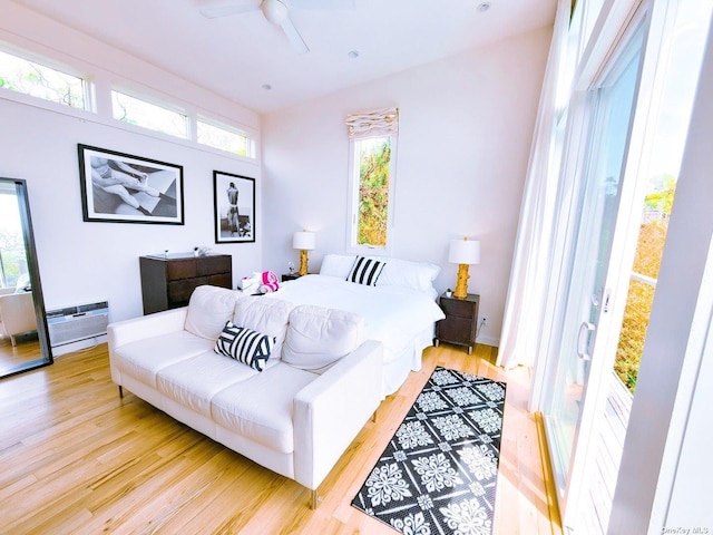 bedroom featuring light hardwood / wood-style floors and ceiling fan