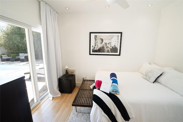 bedroom with ceiling fan, access to exterior, and light wood-type flooring