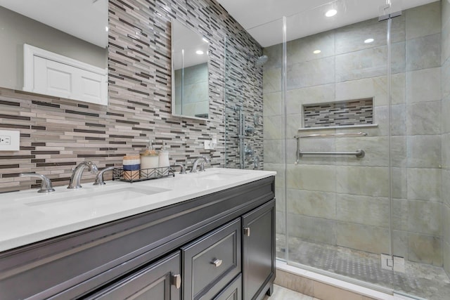 bathroom with walk in shower, vanity, and decorative backsplash