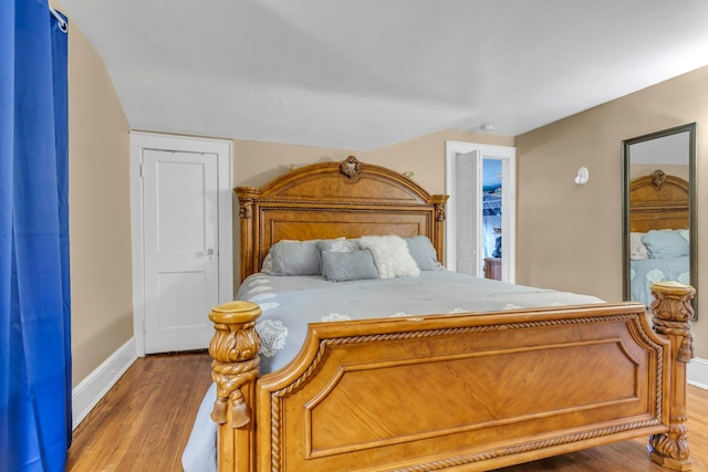 bedroom featuring hardwood / wood-style flooring