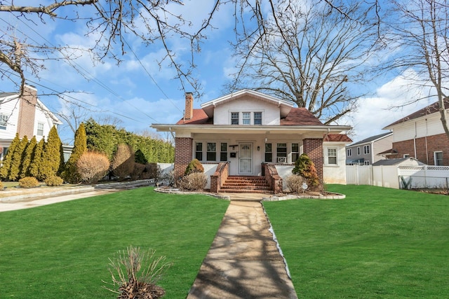 bungalow-style home featuring a front lawn and a porch