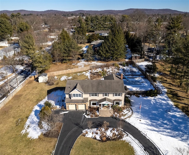 birds eye view of property with a mountain view