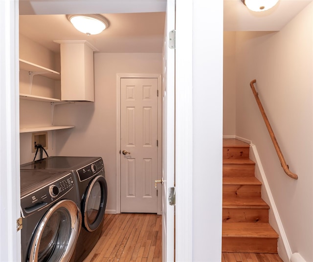 1 Regina Ct, Blauvelt, NY 10913 - laundry room featuring washing machine and clothes dryer, cabinet space, light wood-style floors, and baseboards