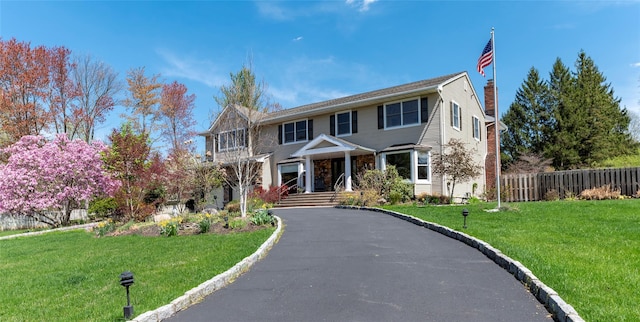 1 Regina Ct, Blauvelt, NY 10913 - view of front of property with fence, a chimney, and a front yard