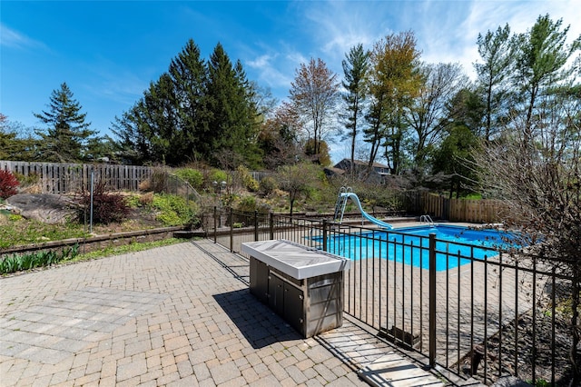 1 Regina Ct, Blauvelt, NY 10913 - view of swimming pool with a water slide, a patio, a fenced in pool, and a fenced backyard