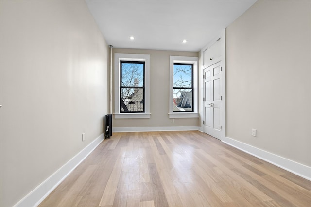 empty room with light wood-type flooring