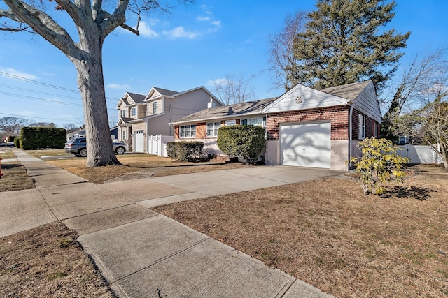 exterior space featuring a garage and a front yard