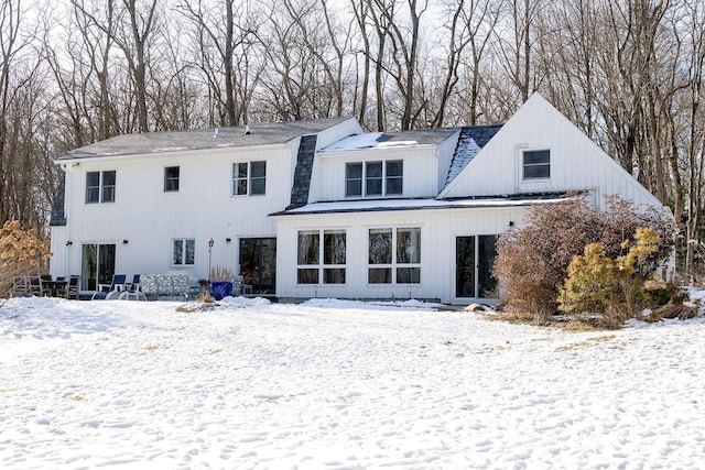 view of snow covered house