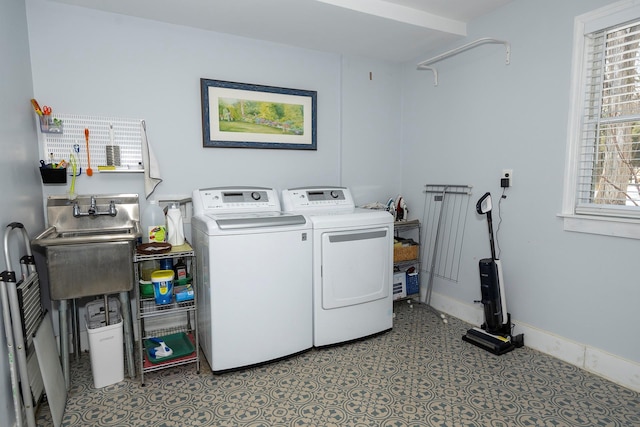 clothes washing area with independent washer and dryer