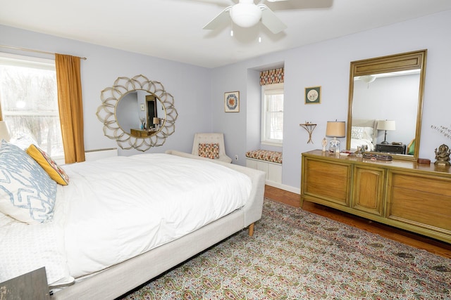 bedroom featuring ceiling fan and wood-type flooring