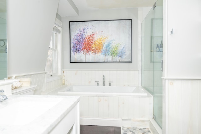 bathroom featuring vanity and separate shower and tub