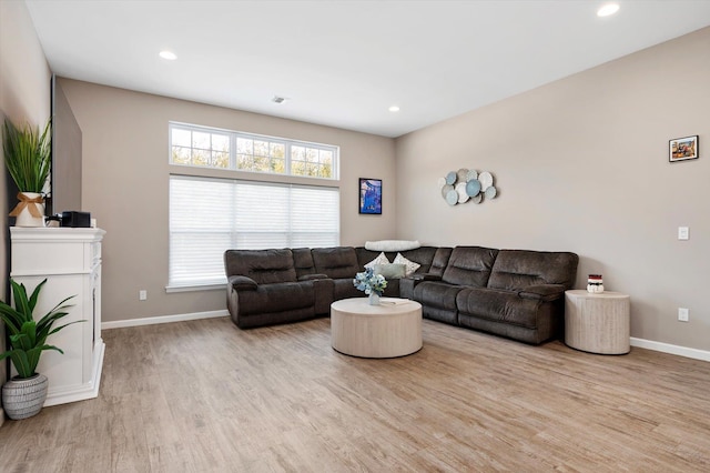 living room with light hardwood / wood-style floors