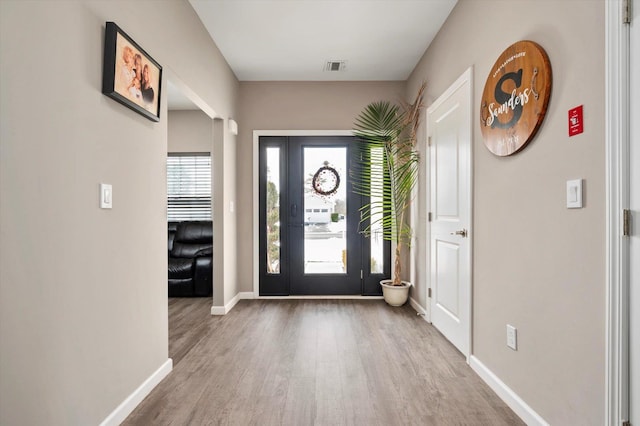 foyer entrance featuring hardwood / wood-style floors