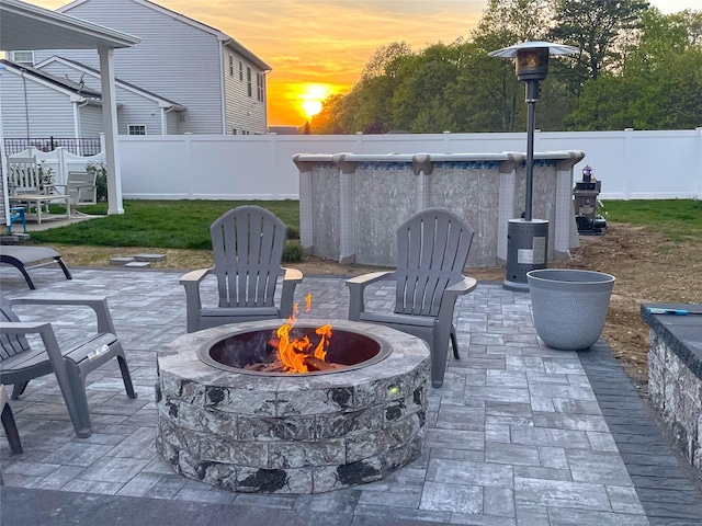 patio terrace at dusk with an outdoor fire pit