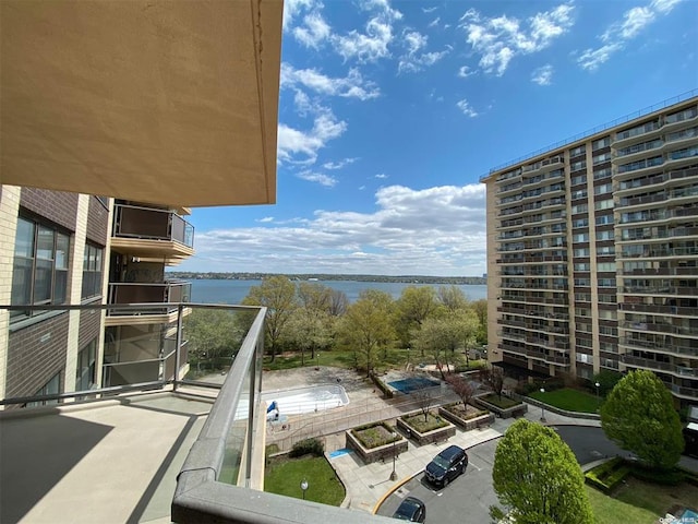 balcony featuring a water view