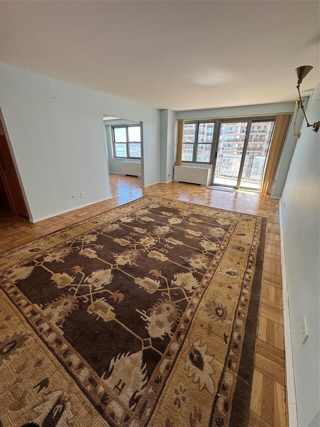 living area featuring baseboards