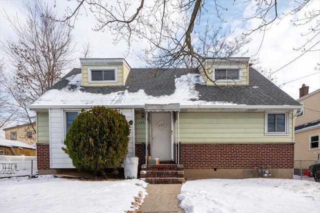 view of new england style home