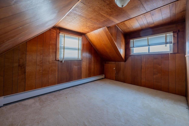 additional living space featuring wood ceiling, wooden walls, vaulted ceiling, and baseboard heating