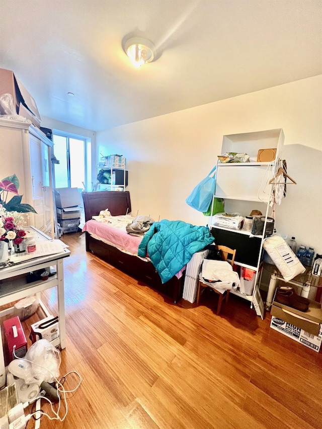 bedroom with hardwood / wood-style floors