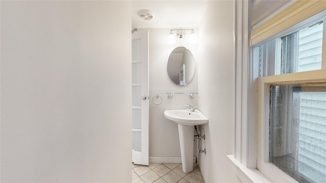 bathroom with a sink and tile patterned floors