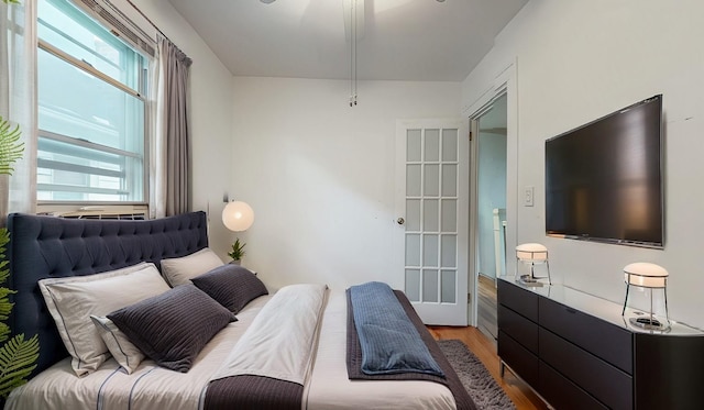 bedroom featuring light wood-style floors