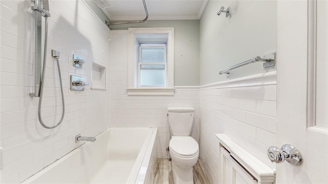 full bath featuring wainscoting, tile walls, toilet, and crown molding