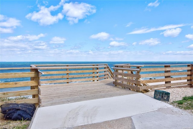 wooden deck with a water view