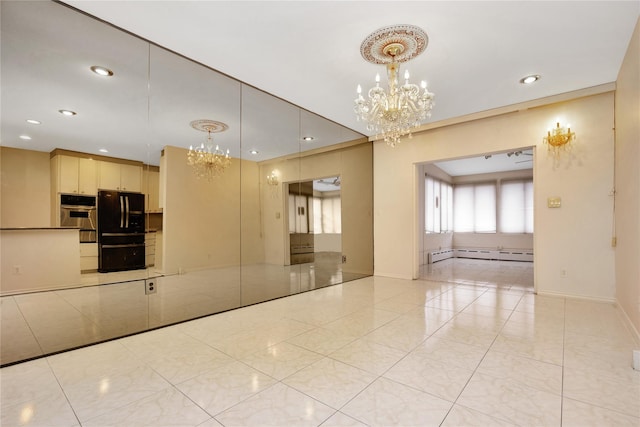 spare room featuring a chandelier, baseboard heating, baseboards, and recessed lighting