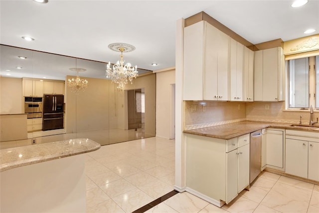 kitchen with decorative backsplash, dishwasher, freestanding refrigerator, a sink, and recessed lighting