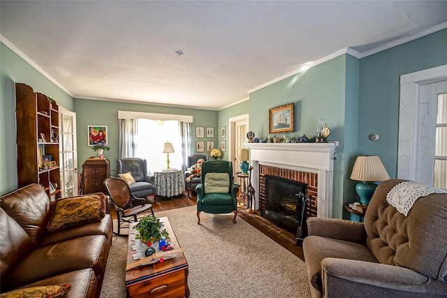 living room featuring wood finished floors, ornamental molding, and a brick fireplace