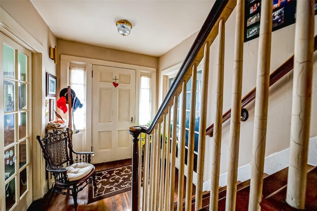 foyer with stairs and wood finished floors