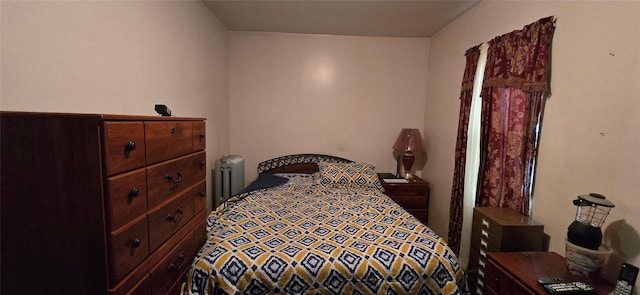 bedroom featuring radiator heating unit
