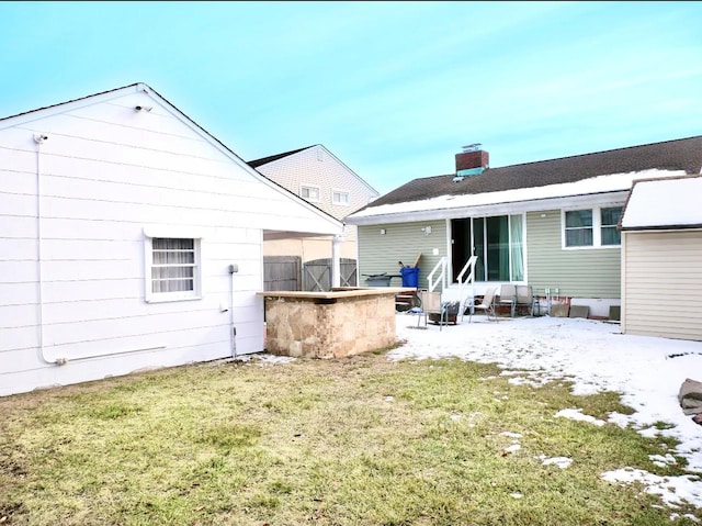 rear view of house with a yard