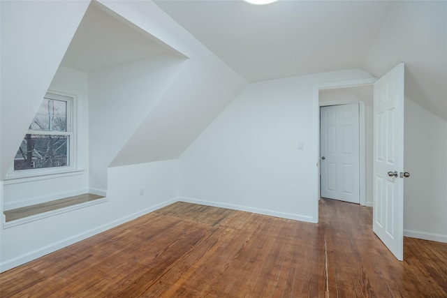 bonus room featuring lofted ceiling and wood-type flooring