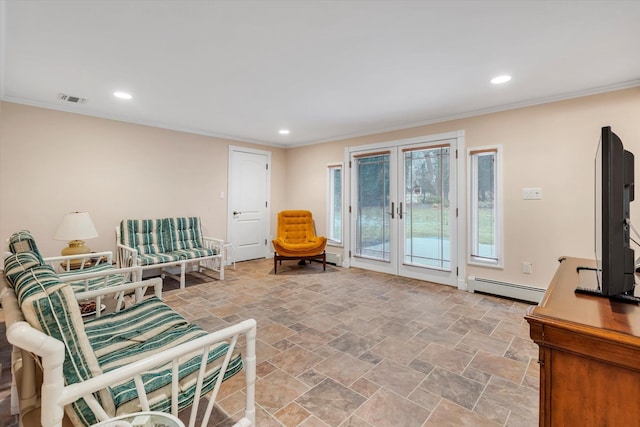 sitting room with a baseboard heating unit, crown molding, and french doors