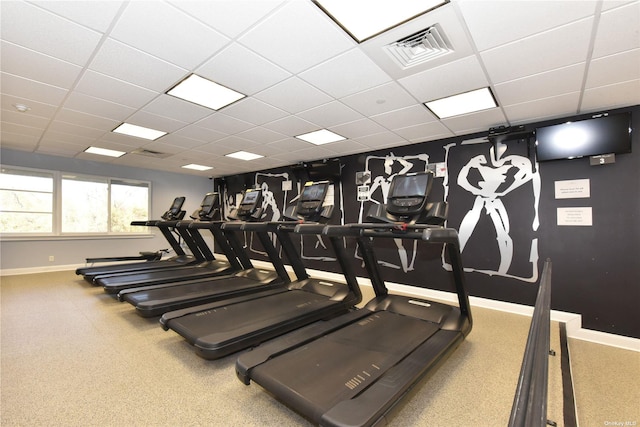 gym featuring a drop ceiling