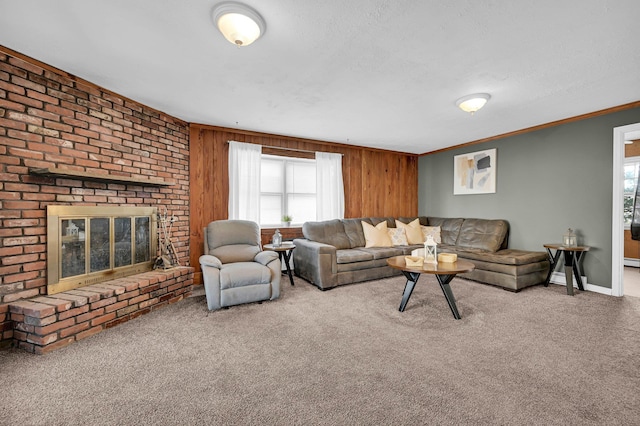 living area with carpet floors, a brick fireplace, crown molding, and a textured ceiling