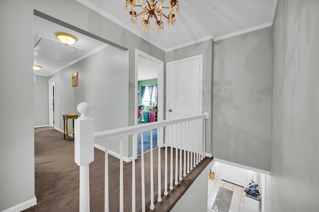 corridor with crown molding, carpet flooring, an upstairs landing, and baseboards