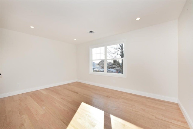 empty room with light hardwood / wood-style floors