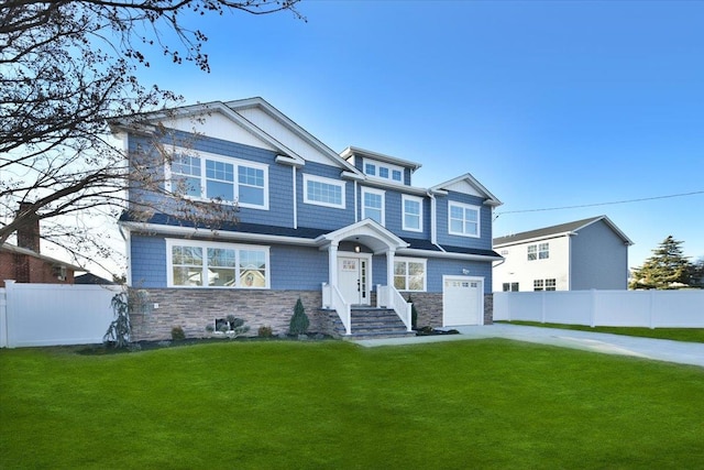 view of front facade with a garage and a front yard