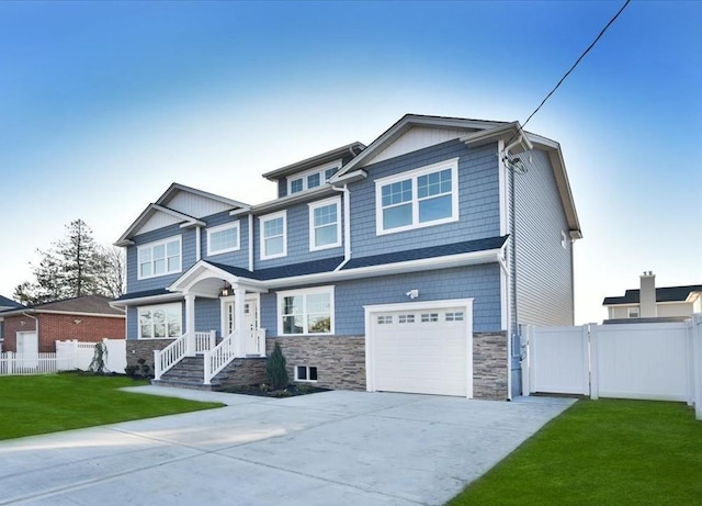 view of front facade with a garage and a front lawn