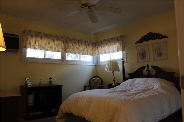 bedroom featuring a wall unit AC and ceiling fan