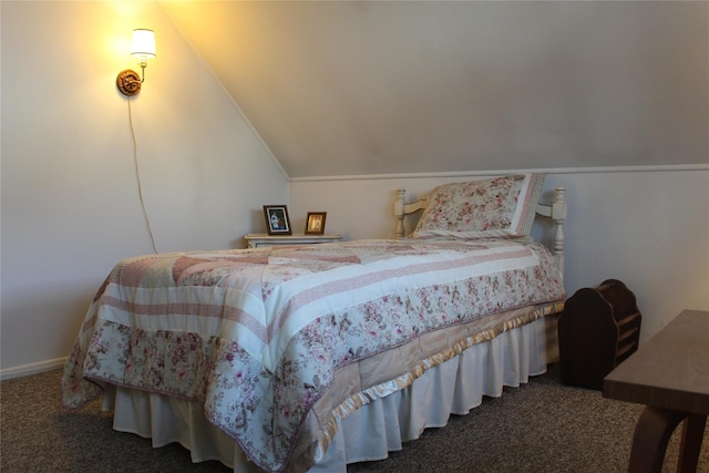 bedroom featuring vaulted ceiling and dark carpet