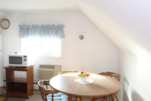 carpeted dining space with vaulted ceiling and an AC wall unit