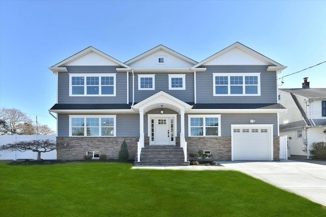 view of front facade featuring a garage and a front lawn